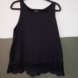 Black tank top with cutout detail at hem